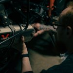 Technician ensuring EV safety.