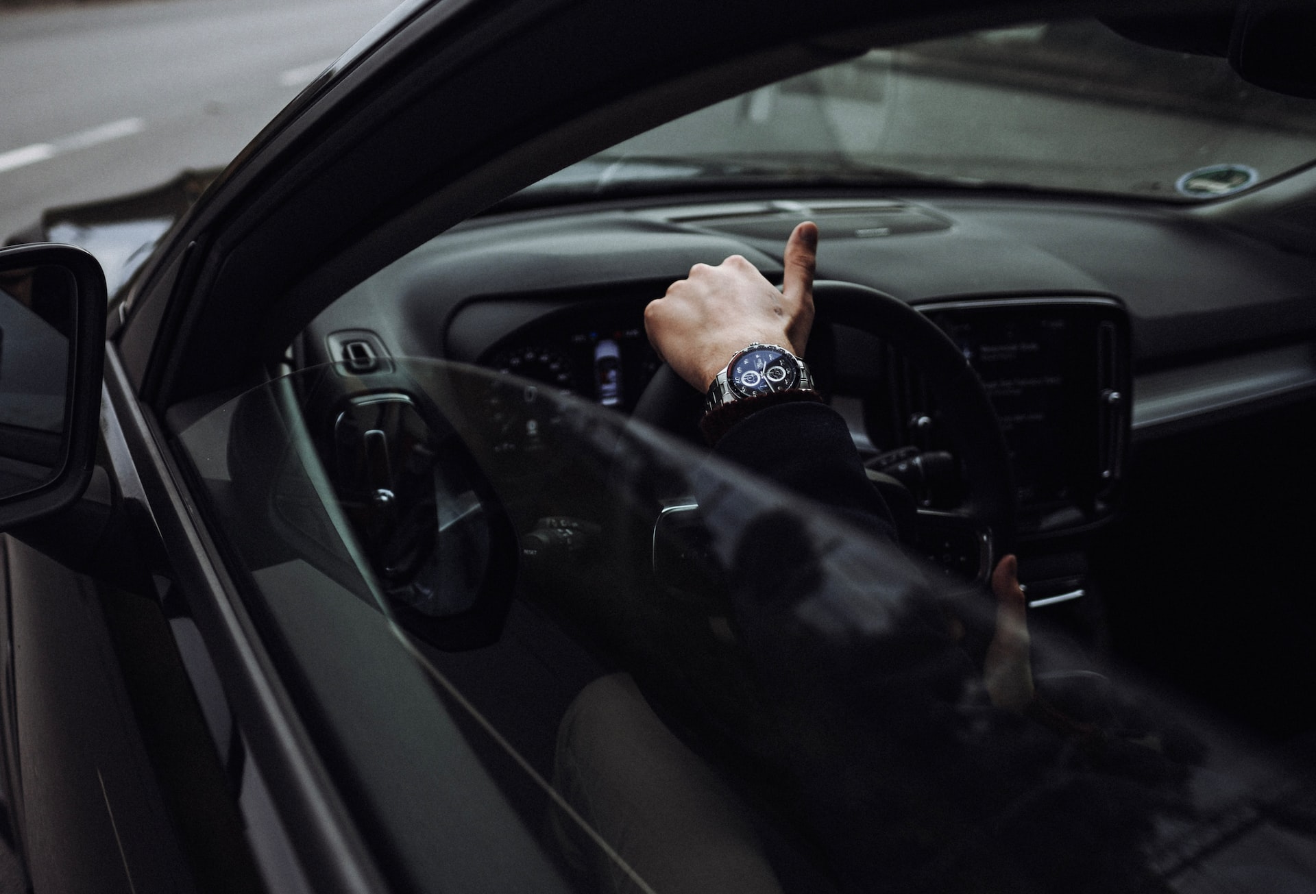 Man holding steering wheel.