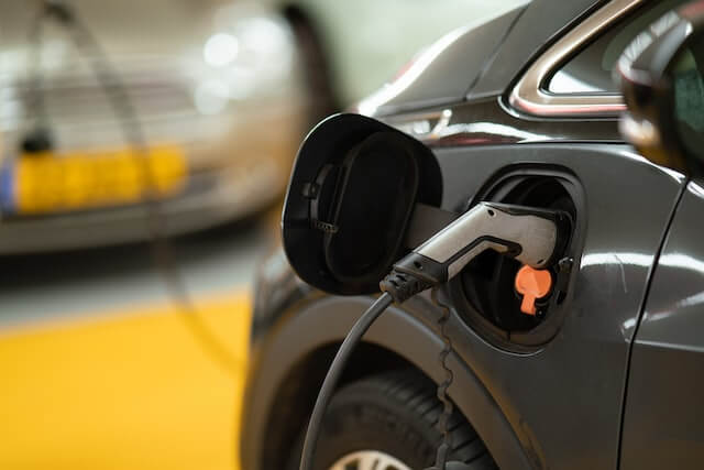 A charging black electric vehicle.