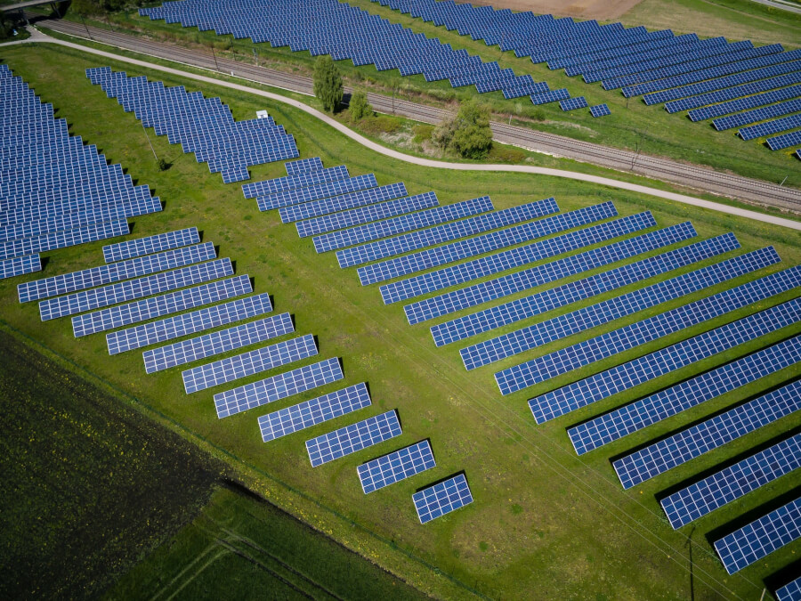 Solar panels generating renewable energy on a large field.