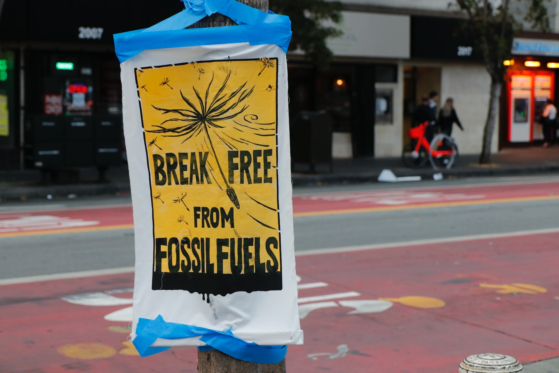 A protest signage against the use of fossil fuels, a non-renewable energy source.