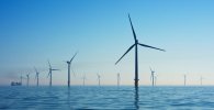 Wind farm on an ocean, generating renewable energy.
