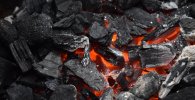Coal on fire. Coal is a nonrenewable energy source.
